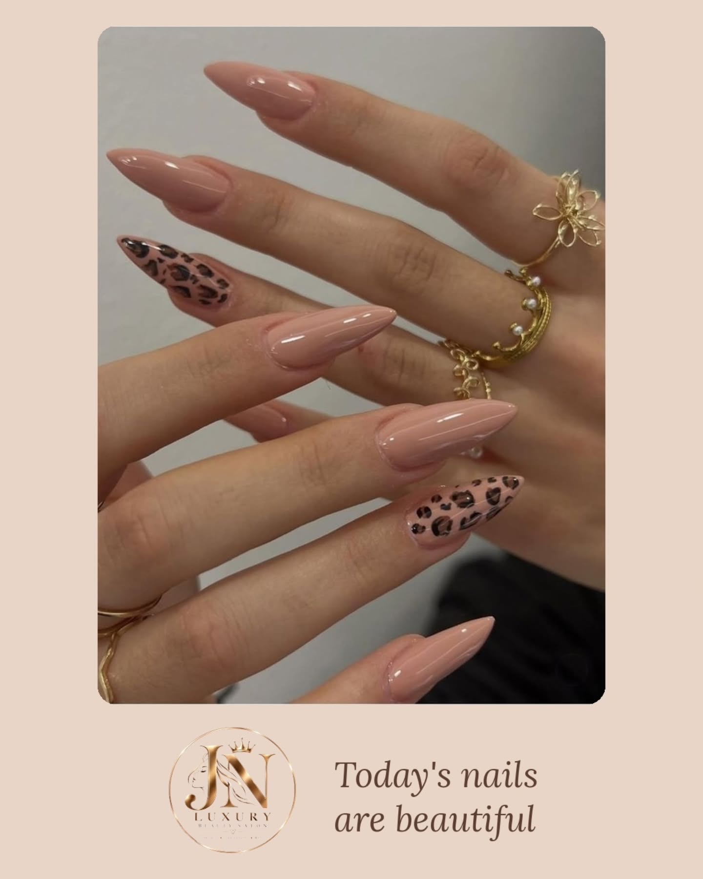 Nude manicure with leopard print accent