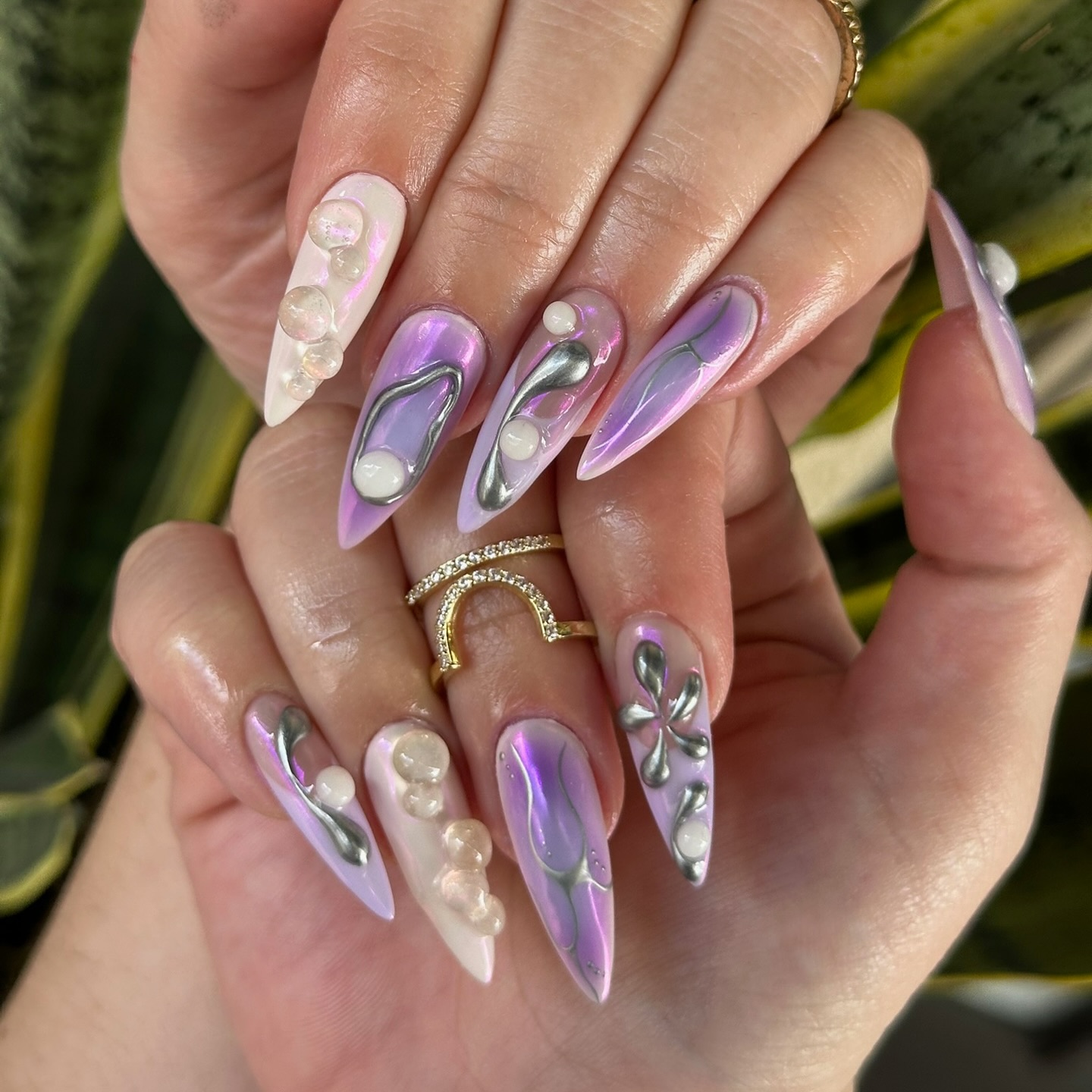 Purple chrome stiletto nails with pearls